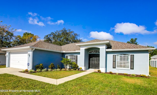 single story home with a garage and a front yard