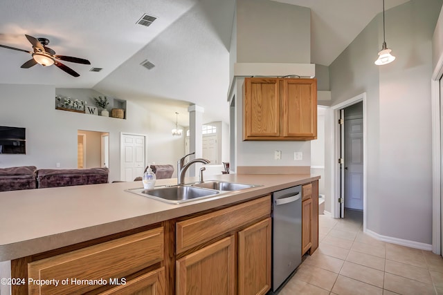 kitchen featuring sink, ceiling fan with notable chandelier, light tile patterned floors, stainless steel dishwasher, and pendant lighting