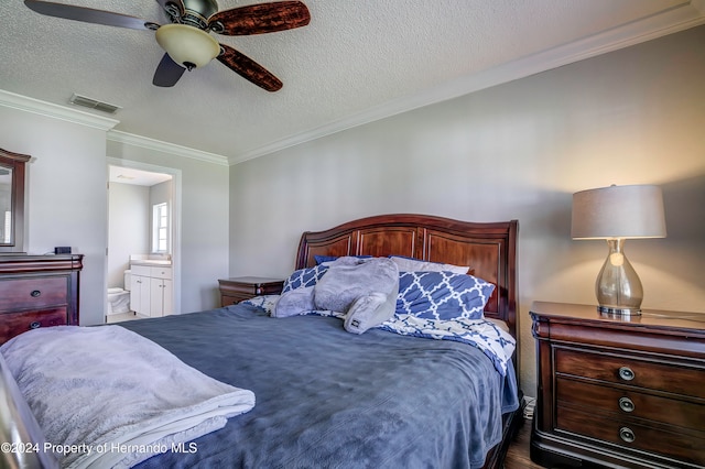 bedroom with ornamental molding, a textured ceiling, ceiling fan, and ensuite bathroom