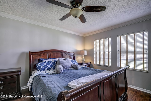 bedroom with a textured ceiling, dark hardwood / wood-style flooring, ceiling fan, and crown molding