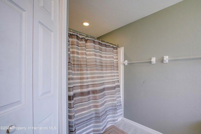 bathroom with tile patterned floors