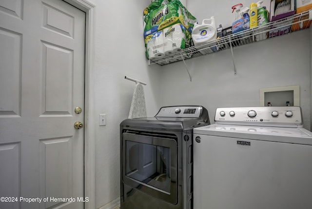 washroom with separate washer and dryer