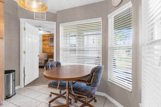 dining room featuring ceiling fan and light tile patterned flooring