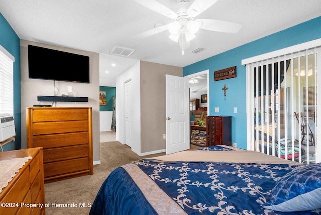 carpeted bedroom with a textured ceiling and ceiling fan