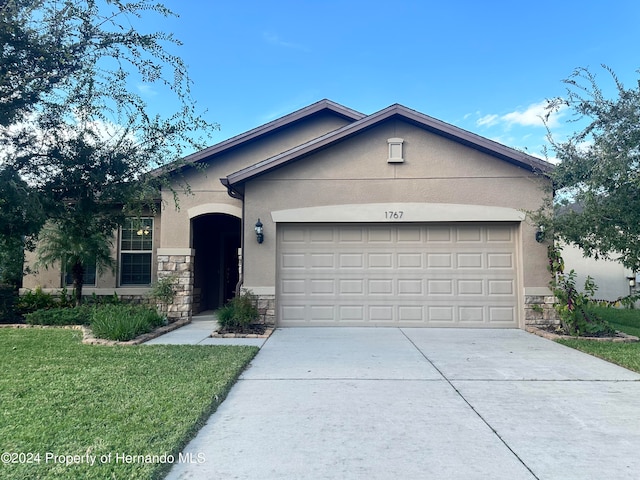 single story home with a garage