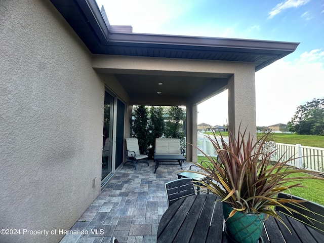 wooden deck with a patio area