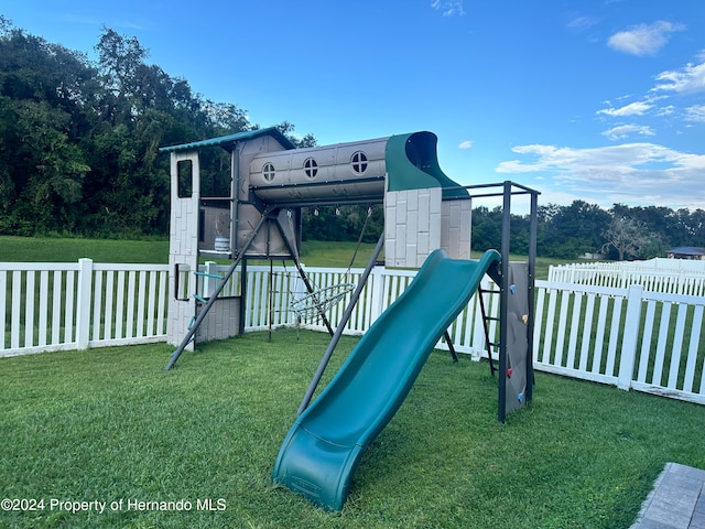 view of playground featuring a lawn