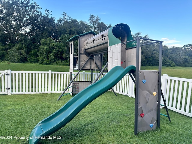 view of jungle gym featuring a yard