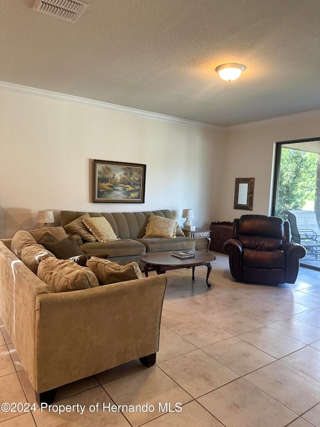 tiled living room with a textured ceiling and crown molding