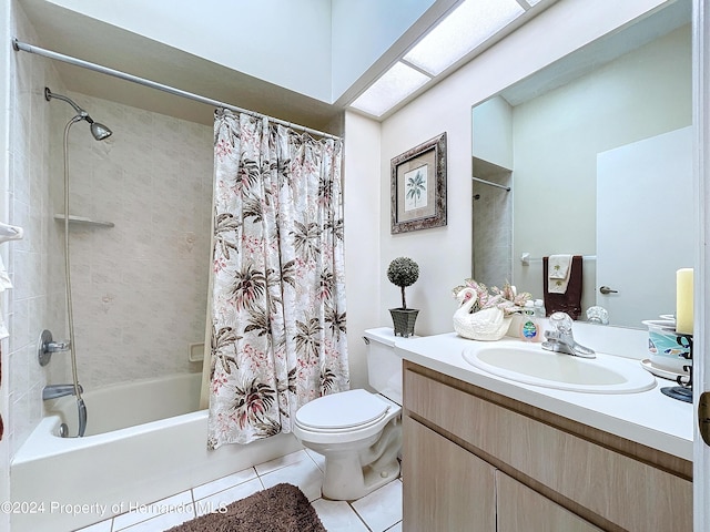 full bathroom featuring vanity, shower / bath combo with shower curtain, tile patterned flooring, and toilet