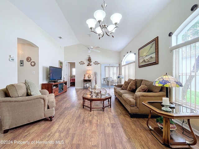 living room featuring hardwood / wood-style floors, ceiling fan with notable chandelier, and vaulted ceiling