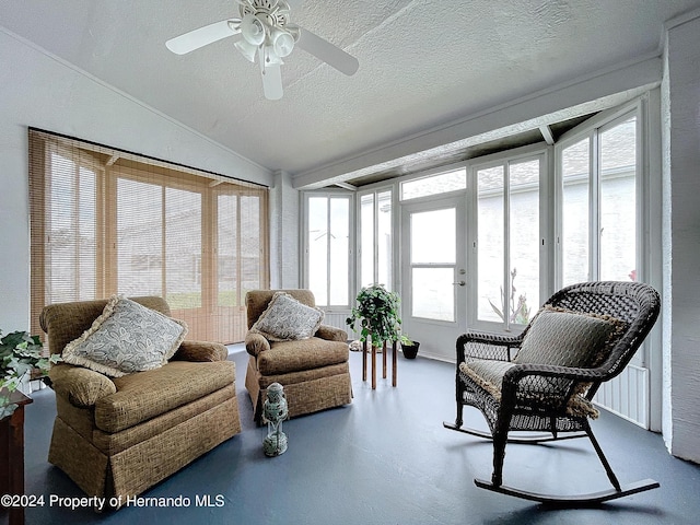 sunroom / solarium with lofted ceiling, french doors, and ceiling fan