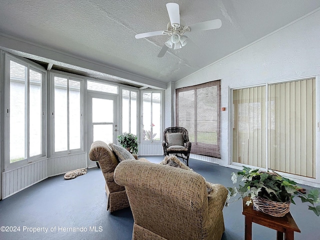 sunroom / solarium with ceiling fan and lofted ceiling