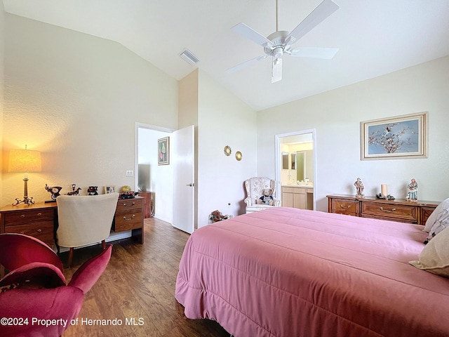 bedroom with dark hardwood / wood-style flooring, lofted ceiling, ceiling fan, and connected bathroom