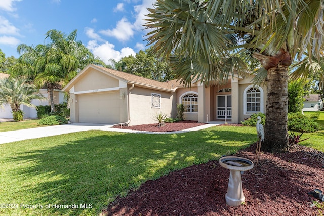 view of front of home with a garage and a front yard