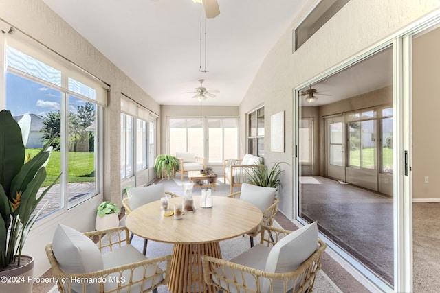 sunroom / solarium featuring lofted ceiling and ceiling fan