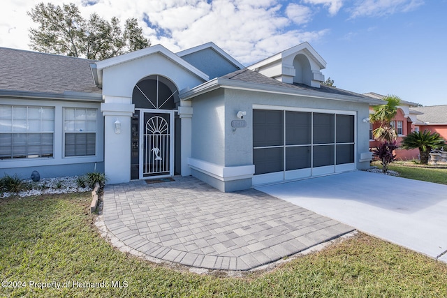 single story home with a garage