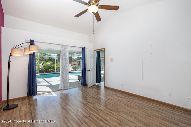 unfurnished room with high vaulted ceiling, ceiling fan, and dark hardwood / wood-style floors