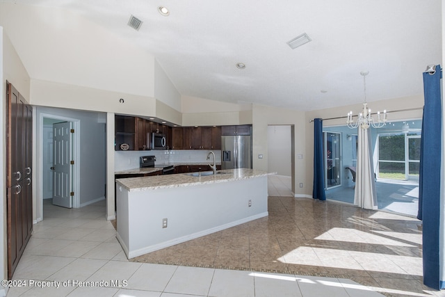 kitchen featuring stainless steel appliances, dark brown cabinetry, sink, lofted ceiling, and pendant lighting