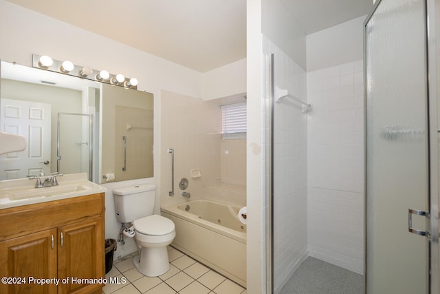 full bathroom featuring vanity, tile patterned flooring, shower with separate bathtub, and toilet