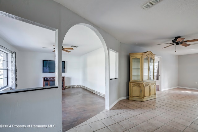 unfurnished room featuring ceiling fan and light wood-type flooring