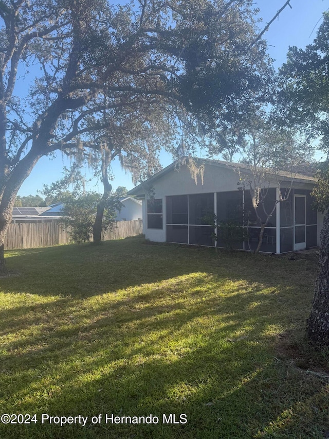 view of yard featuring a sunroom