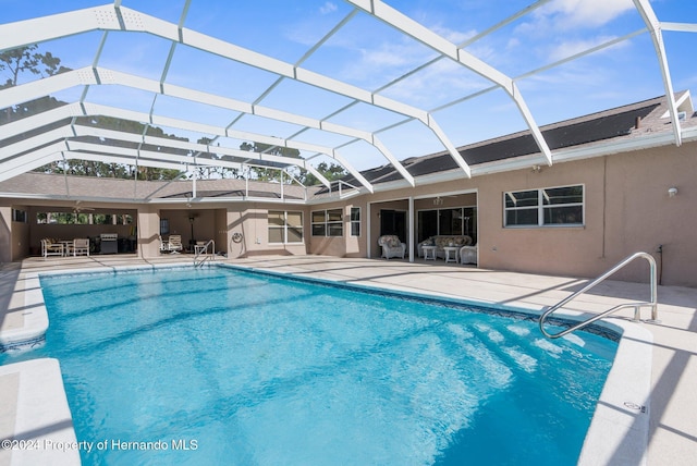 8016 Bellevista Ct, Spring Hill, FL 34606 - outdoor pool featuring a patio and a lanai