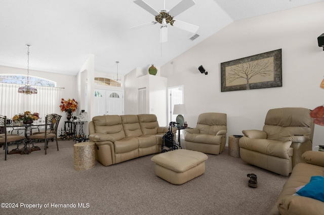 8016 Bellevista Ct, Spring Hill, FL 34606 - carpeted living area with lofted ceiling, a ceiling fan, and a chandelier