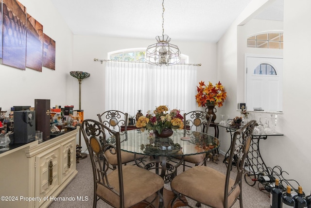 8016 Bellevista Ct, Spring Hill, FL 34606 - carpeted dining room featuring a chandelier