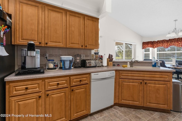 8016 Bellevista Ct, Spring Hill, FL 34606 - kitchen with dishwasher, a chandelier, brown cabinets, a sink, and vaulted ceiling