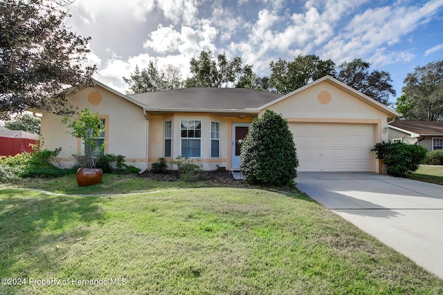 single story home with a garage and a front yard