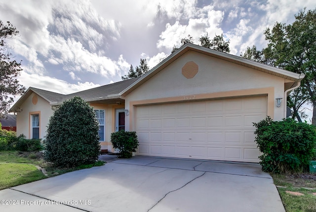 ranch-style home with a garage