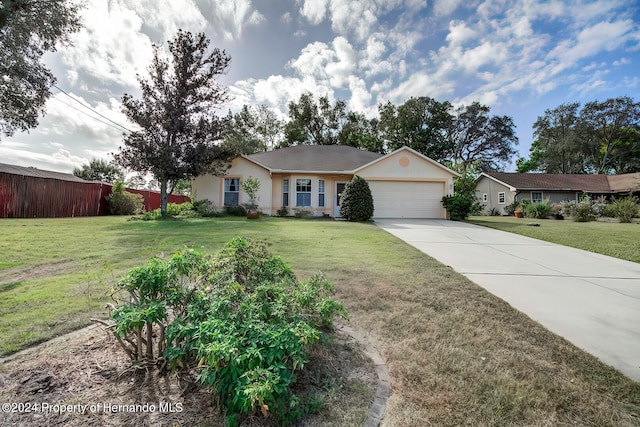 ranch-style home with a front lawn and a garage