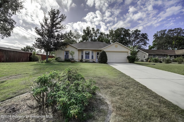 3472 Hartley Rd, Spring Hill, FL 34606 - single story home with a garage, stucco siding, and concrete driveway