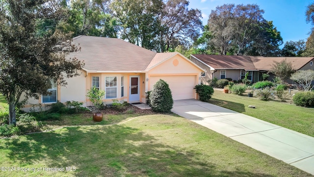 ranch-style home with a garage and a front lawn