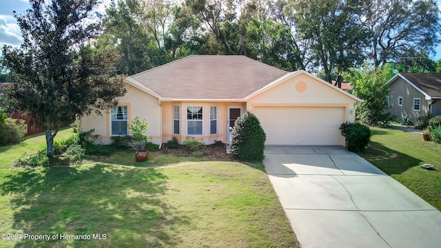 ranch-style home with a garage and a front yard