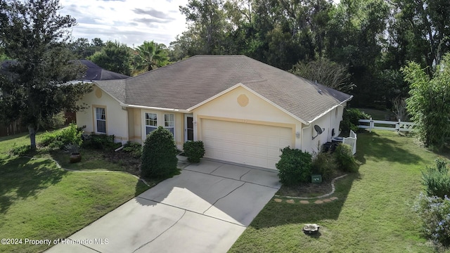 3472 Hartley Rd, Spring Hill, FL 34606 - ranch-style home with stucco siding, a garage, concrete driveway, and roof with shingles