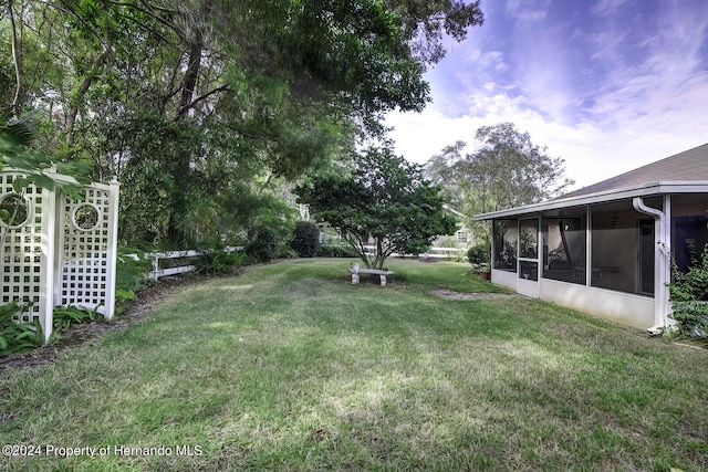 3472 Hartley Rd, Spring Hill, FL 34606 - view of grassy yard with a sunroom