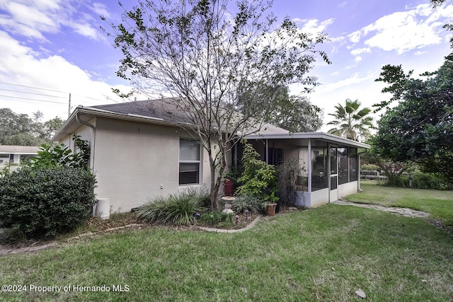 3472 Hartley Rd, Spring Hill, FL 34606 - back of property featuring a sunroom and a yard