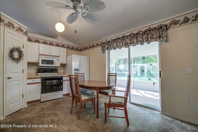 dining room with ceiling fan and vaulted ceiling