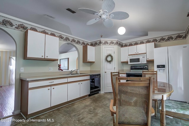 kitchen featuring black appliances, white cabinetry, vaulted ceiling, and ceiling fan