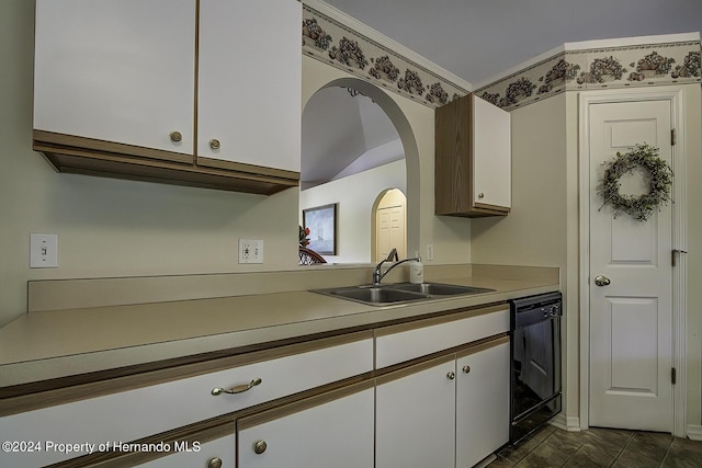 3472 Hartley Rd, Spring Hill, FL 34606 - kitchen featuring black dishwasher, a sink, white cabinetry, light countertops, and arched walkways