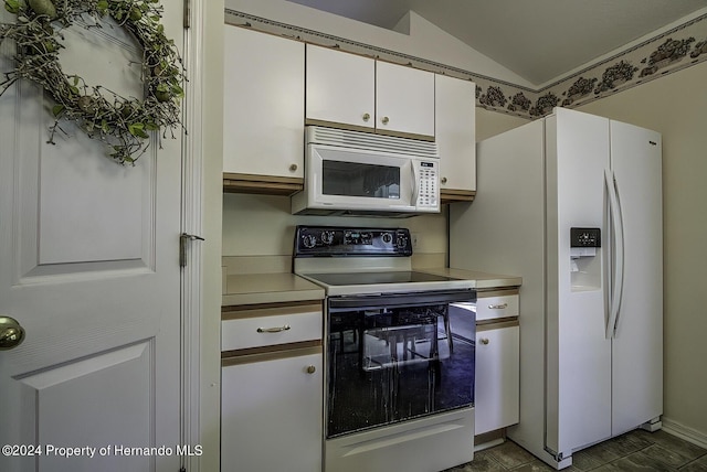 3472 Hartley Rd, Spring Hill, FL 34606 - kitchen with white appliances, light countertops, white cabinets, and lofted ceiling