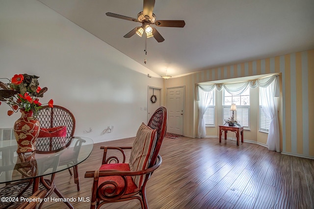 interior space with lofted ceiling, hardwood / wood-style flooring, and ceiling fan