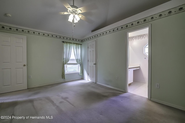 3472 Hartley Rd, Spring Hill, FL 34606 - carpeted spare room with a ceiling fan, vaulted ceiling, a smoke detector, and baseboards