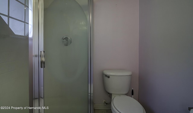 3472 Hartley Rd, Spring Hill, FL 34606 - full bathroom with a shower stall and toilet