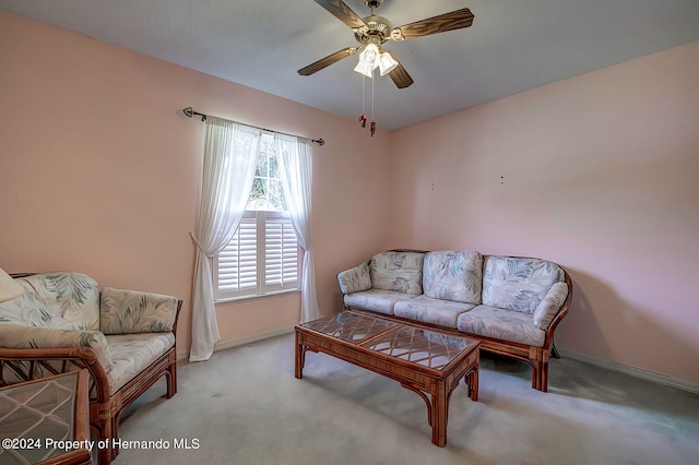 living room featuring light carpet and ceiling fan