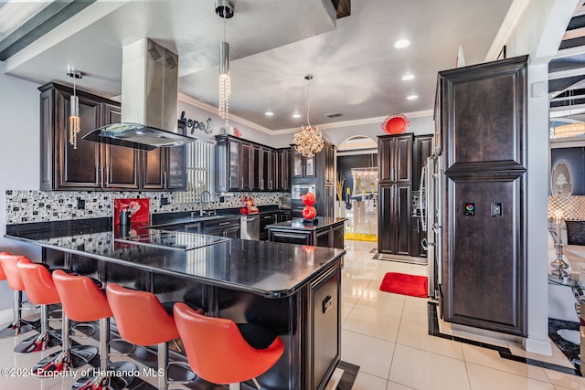 kitchen featuring island range hood, black electric stovetop, decorative backsplash, and a center island