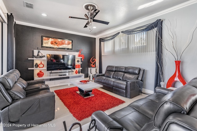 tiled living room featuring ceiling fan and crown molding