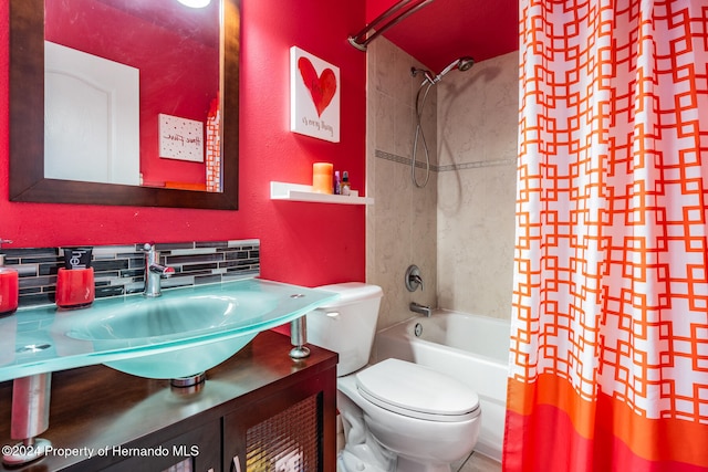 full bathroom featuring shower / tub combo with curtain, tasteful backsplash, vanity, and toilet